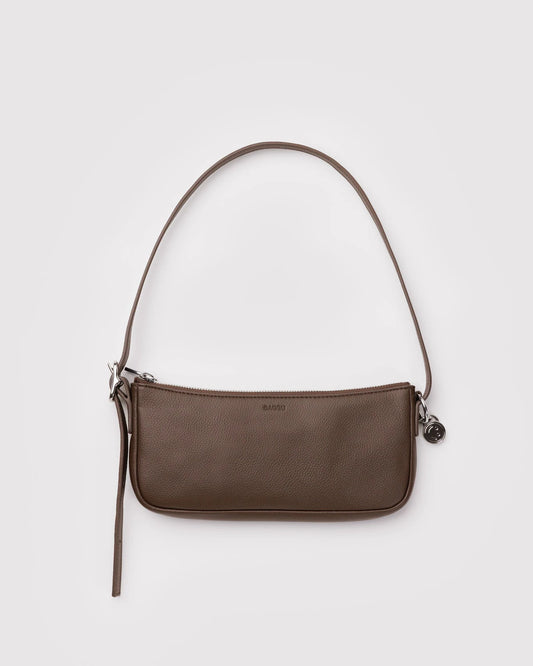 Brown shoulder bag on a light gray background
