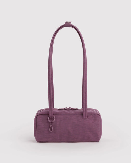BAGGU Small Nylon Bowler Bag in Wild Plum colour on a grey background 