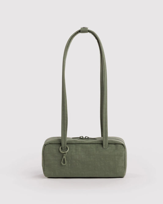 An olive green nylon shoulder bag with a long, slender top handle and a zippered closure, shown against a plain light gray background.