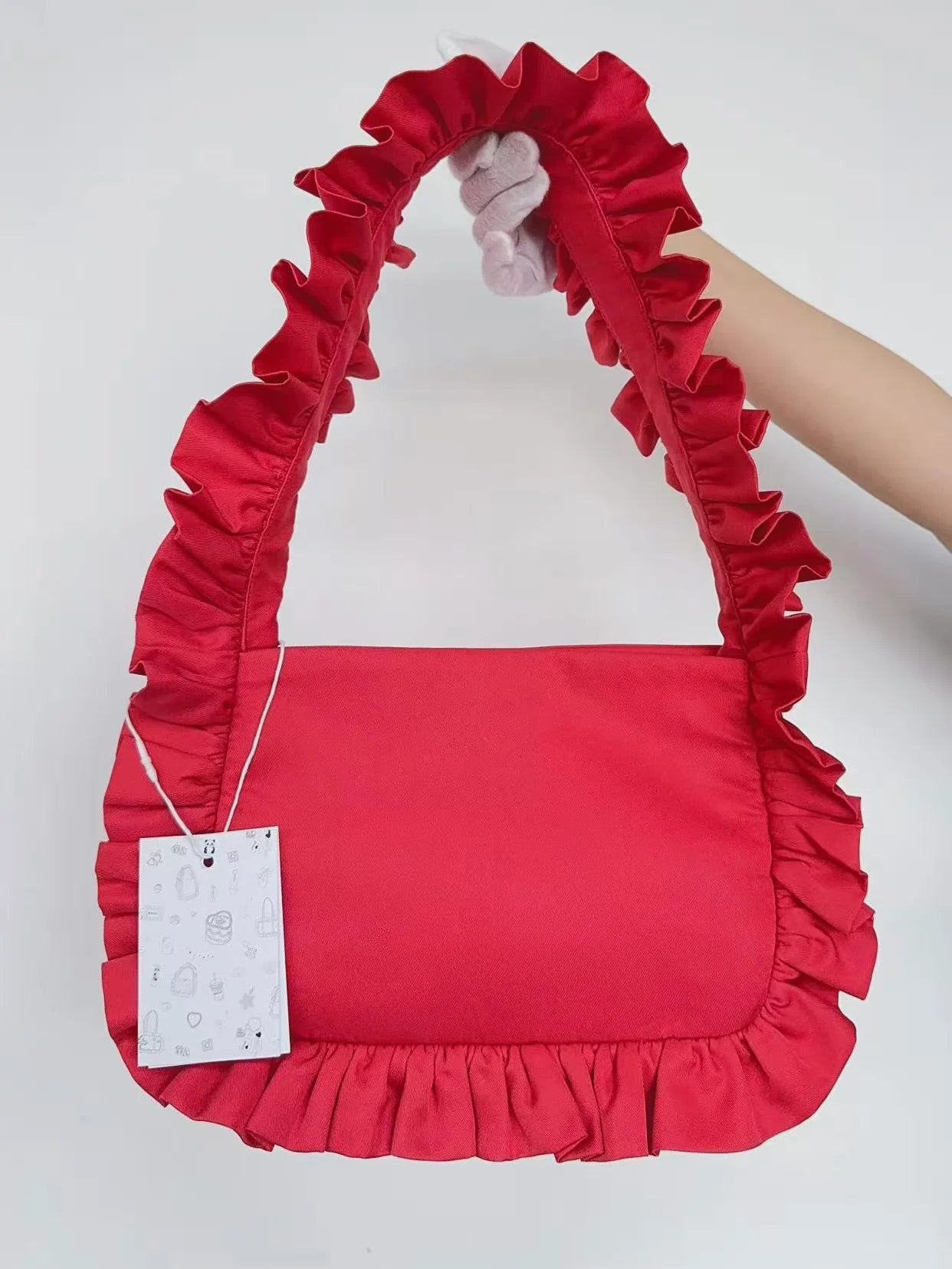 baggy london baguette bag in red ruffle on a white background