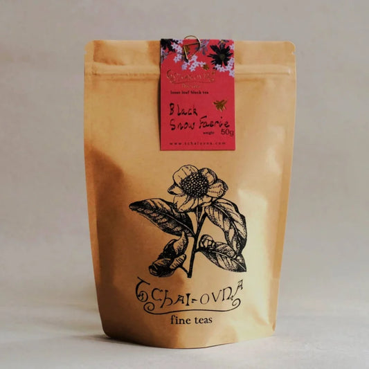 Tchai Ovna Black Snow Tea in a brown paper bag 