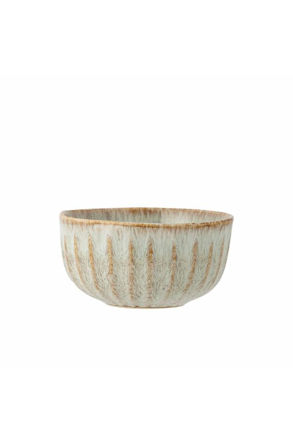 Ceramic bowl with a textured surface on a white background