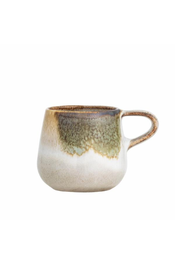 Ceramic mug with a gradient design on a white background