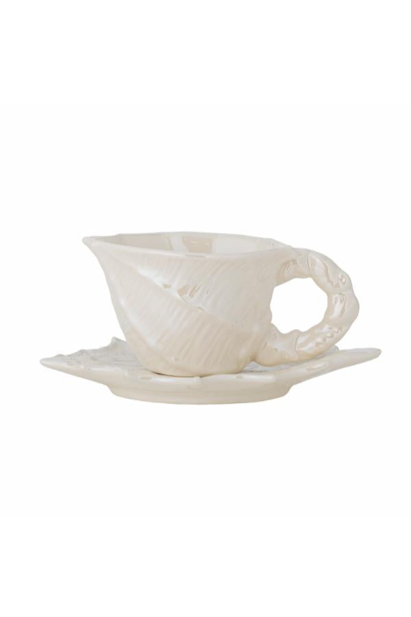 White ceramic cup and saucer on a white background