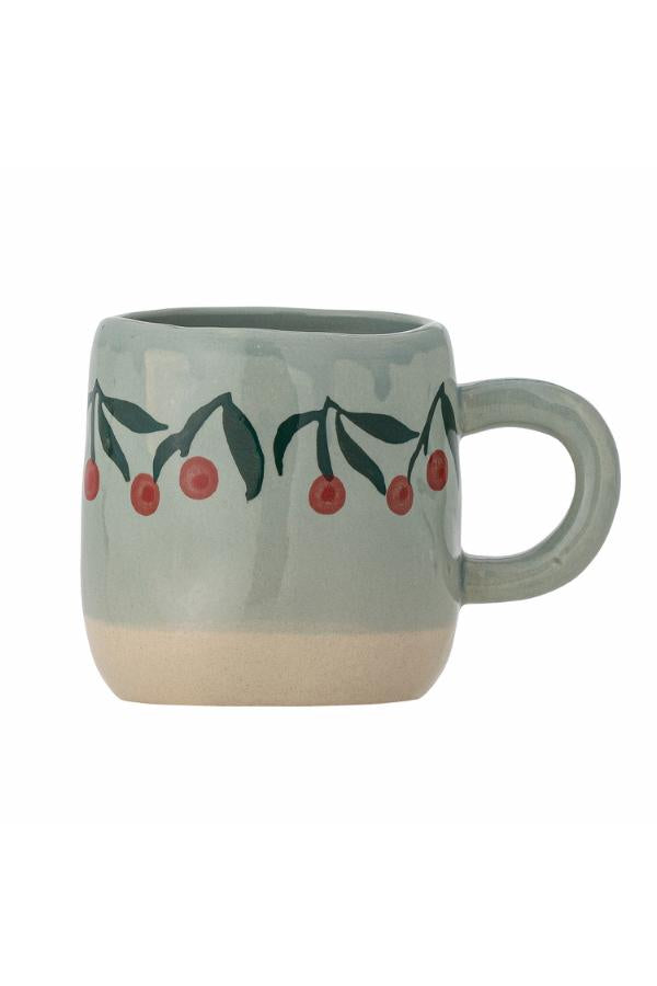 Ceramic mug with cherry design on a white background