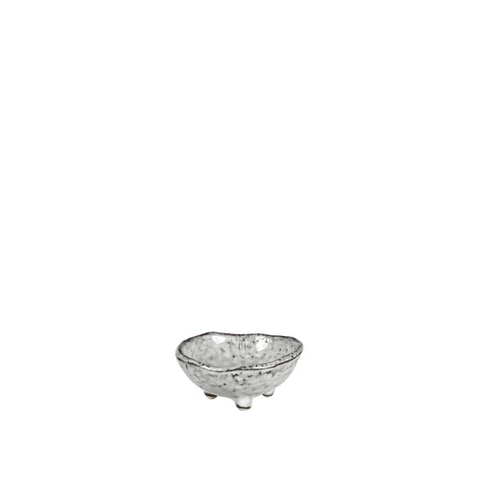 A small ceramic bowl with a textured speckled glaze, resting on three short feet against a solid white background.