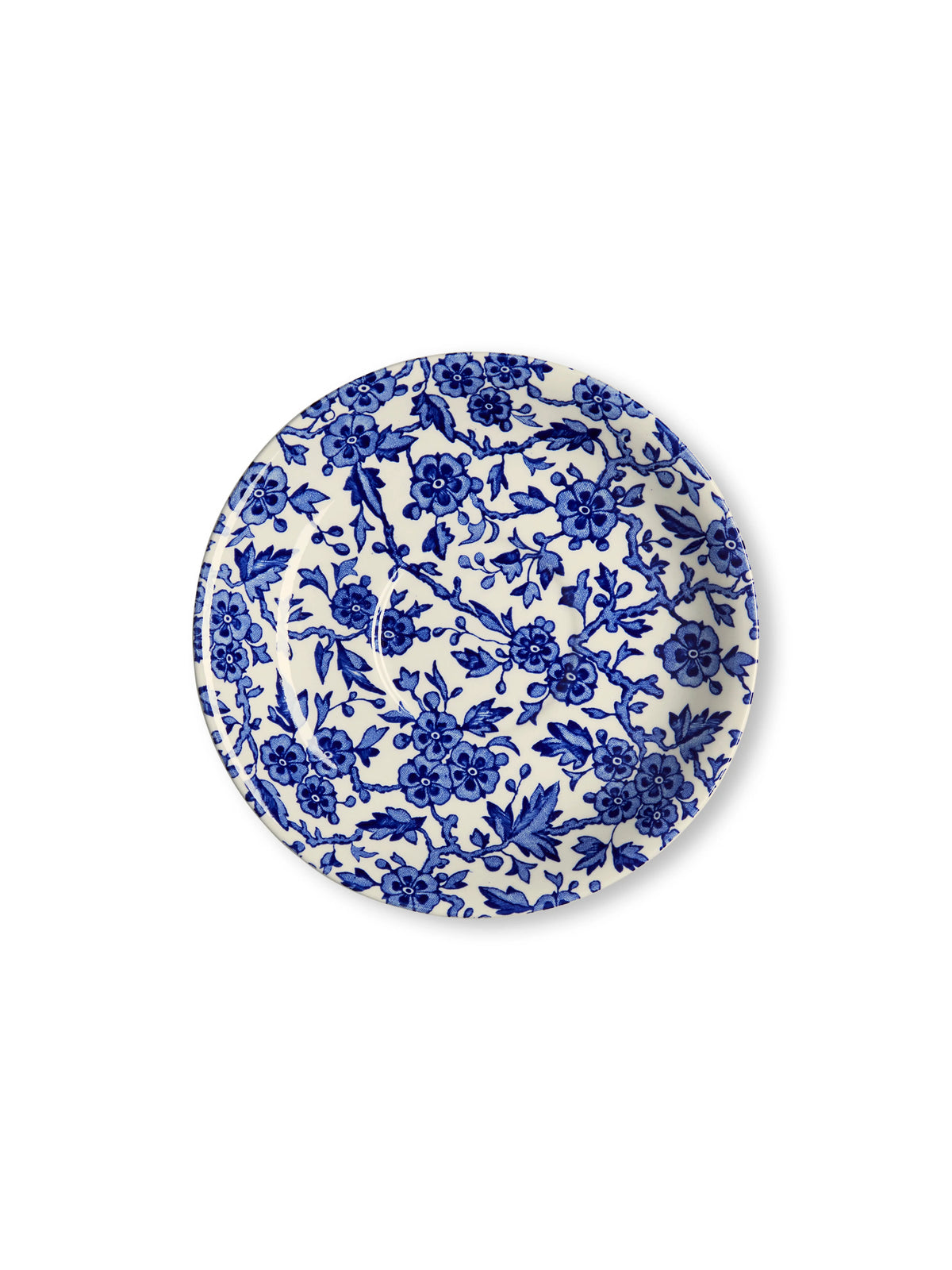 A round ceramic plate with a classic blue and white floral pattern, photographed from directly above on a clean white background.
