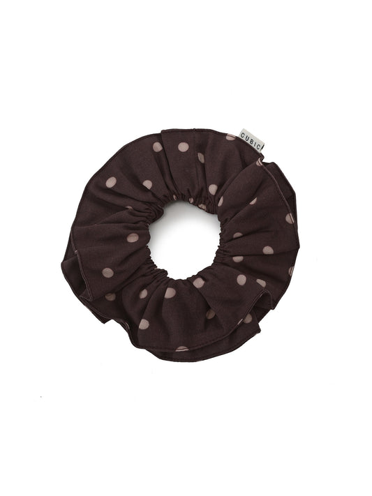 Brown scrunchie with pink polka dots on a white background