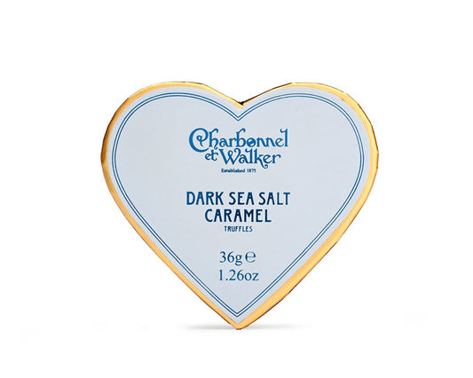 Box of truffles in a blue heart shaped box on a white background 