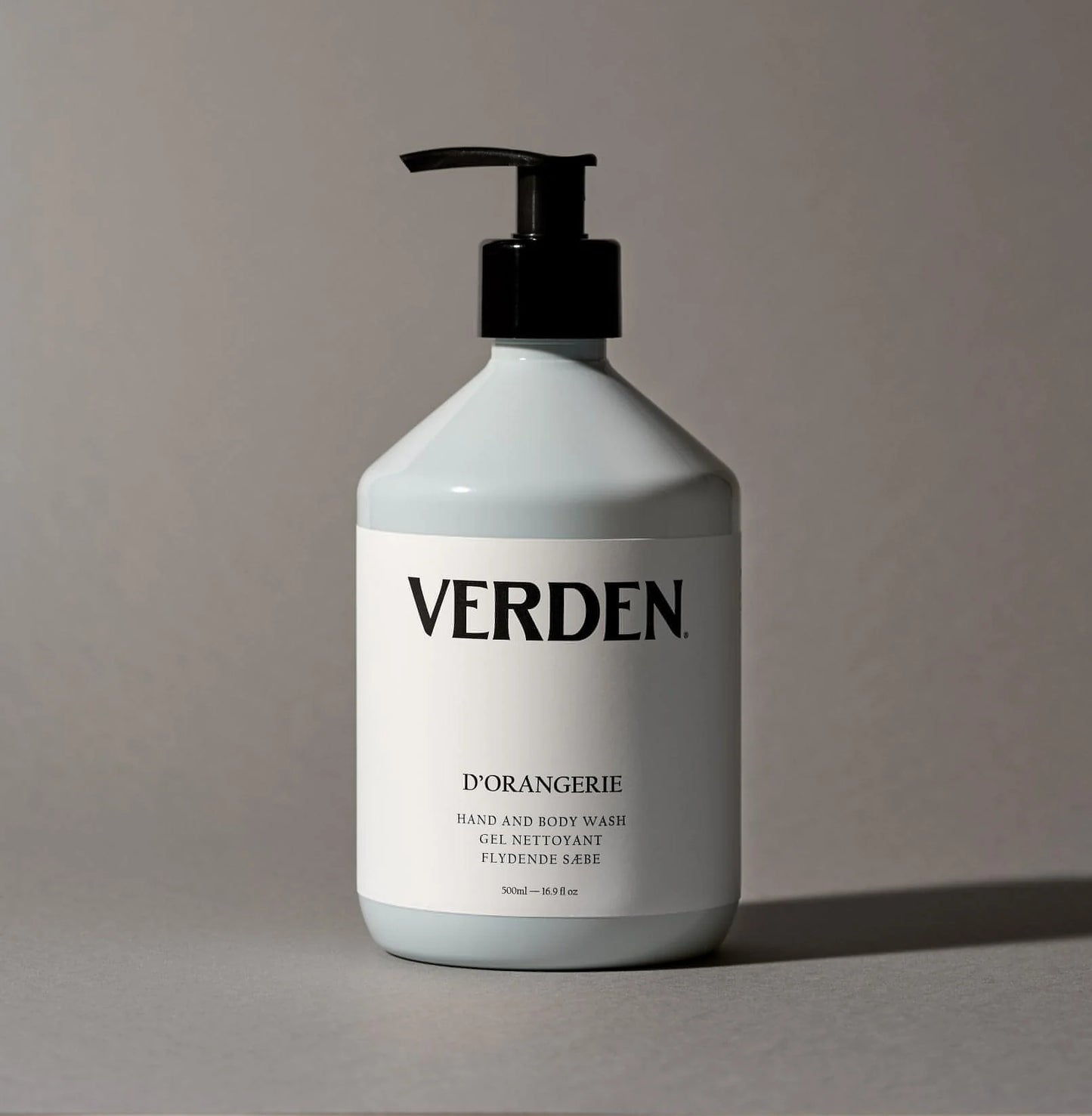 Baby blue bottle with black pump labeled 'VERDEN' on a gray background