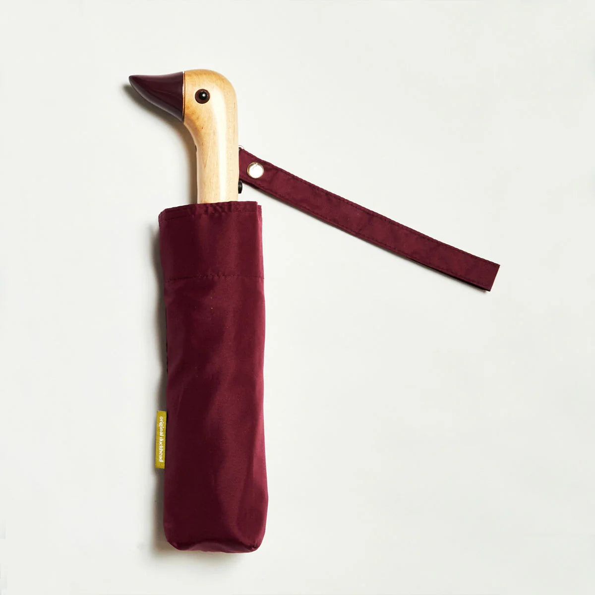 Original Duckhead Signature Compact Umbrella in Cherry colour on a white background 