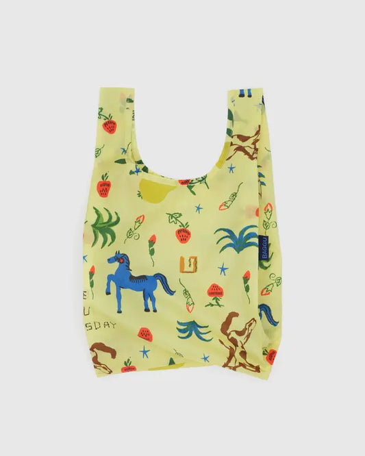 Reusable shopping bag with colorful animal and plant pattern on a light yellow background