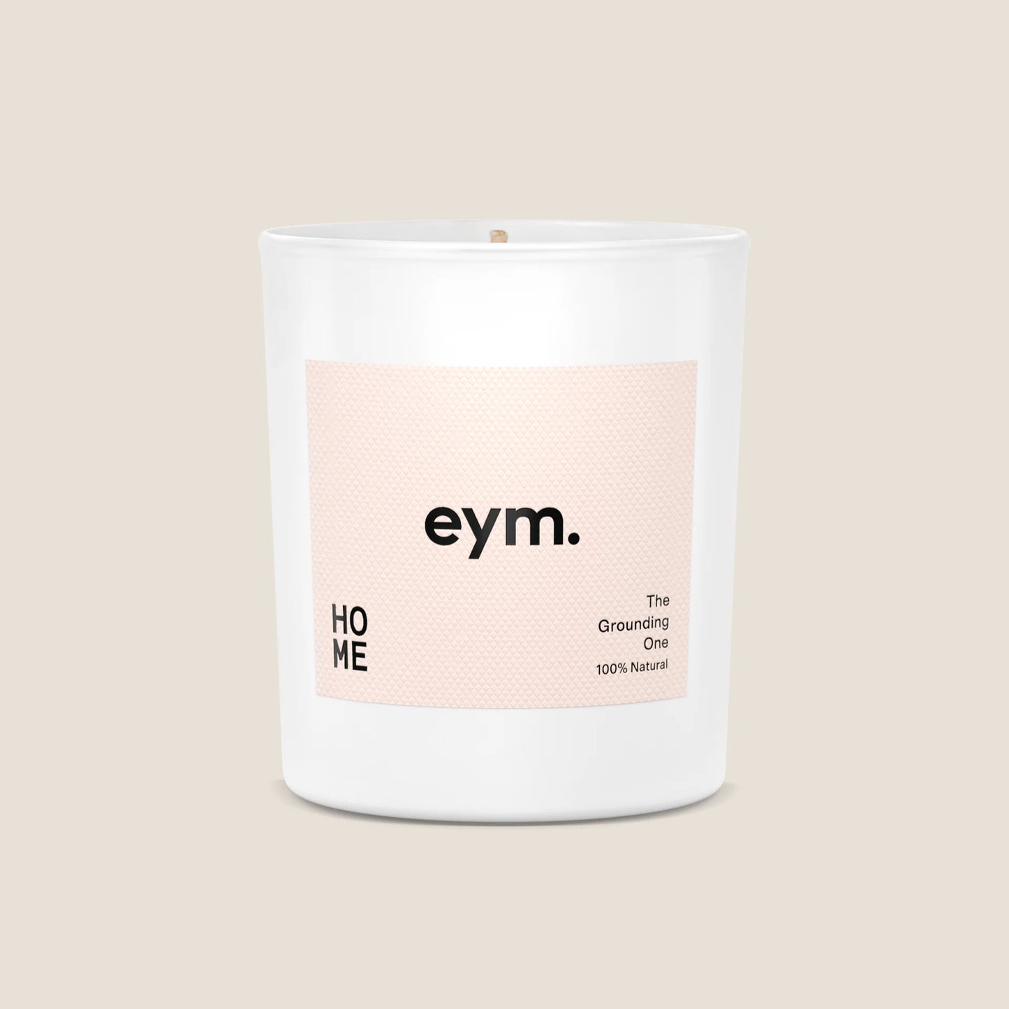 Eym Home Scented Candle with pink label in the front featuing the eym logo