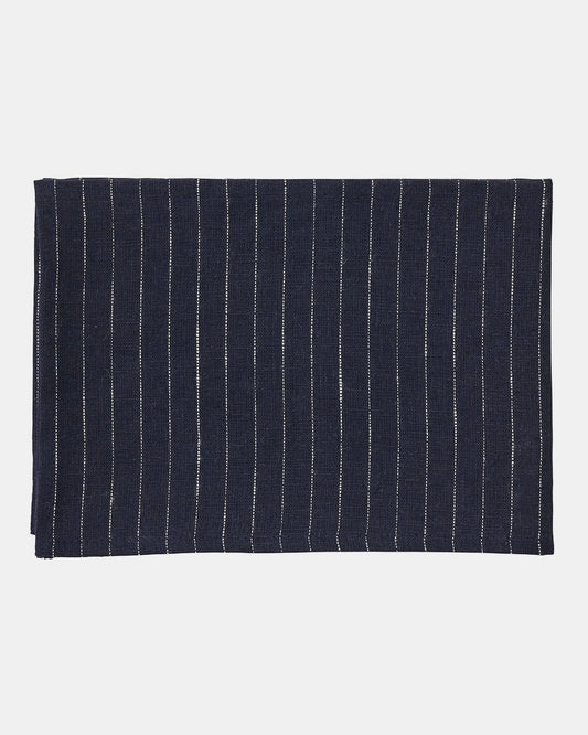 Navy blue fabric with white pinstripes on a light gray background