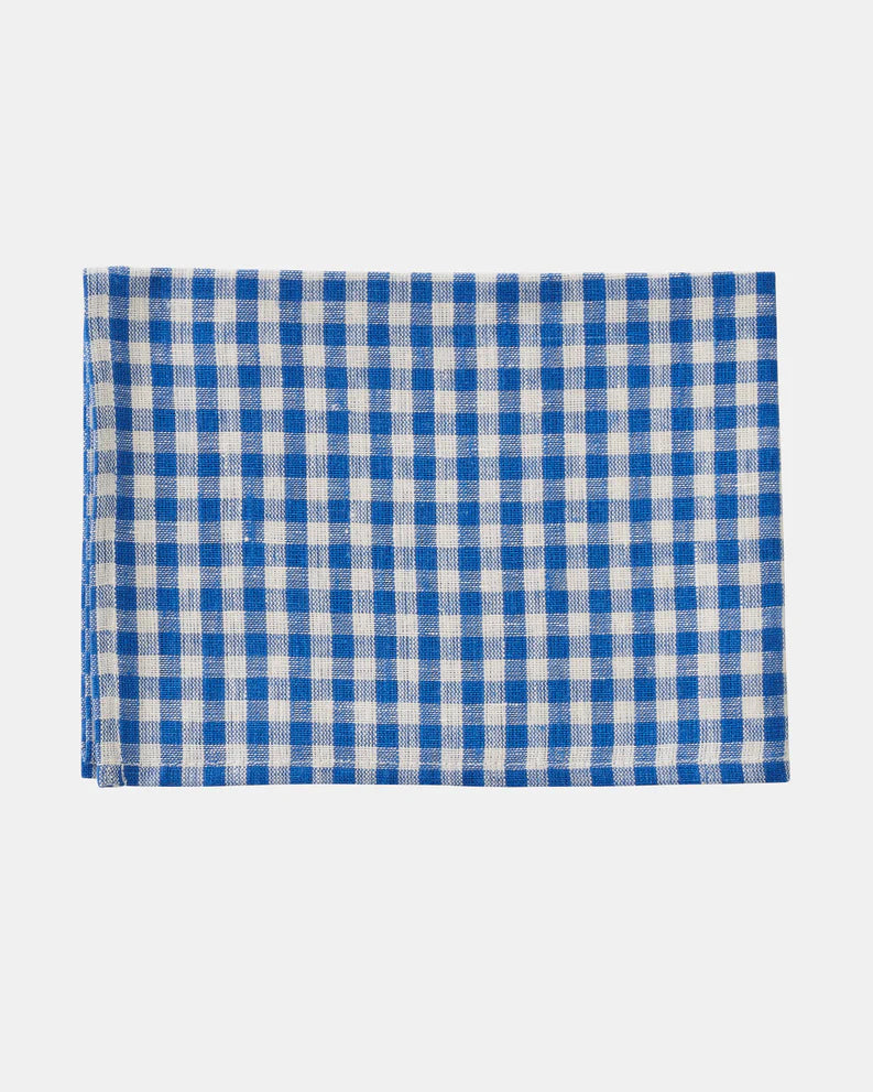 Blue and white checkered fabric on a light gray background