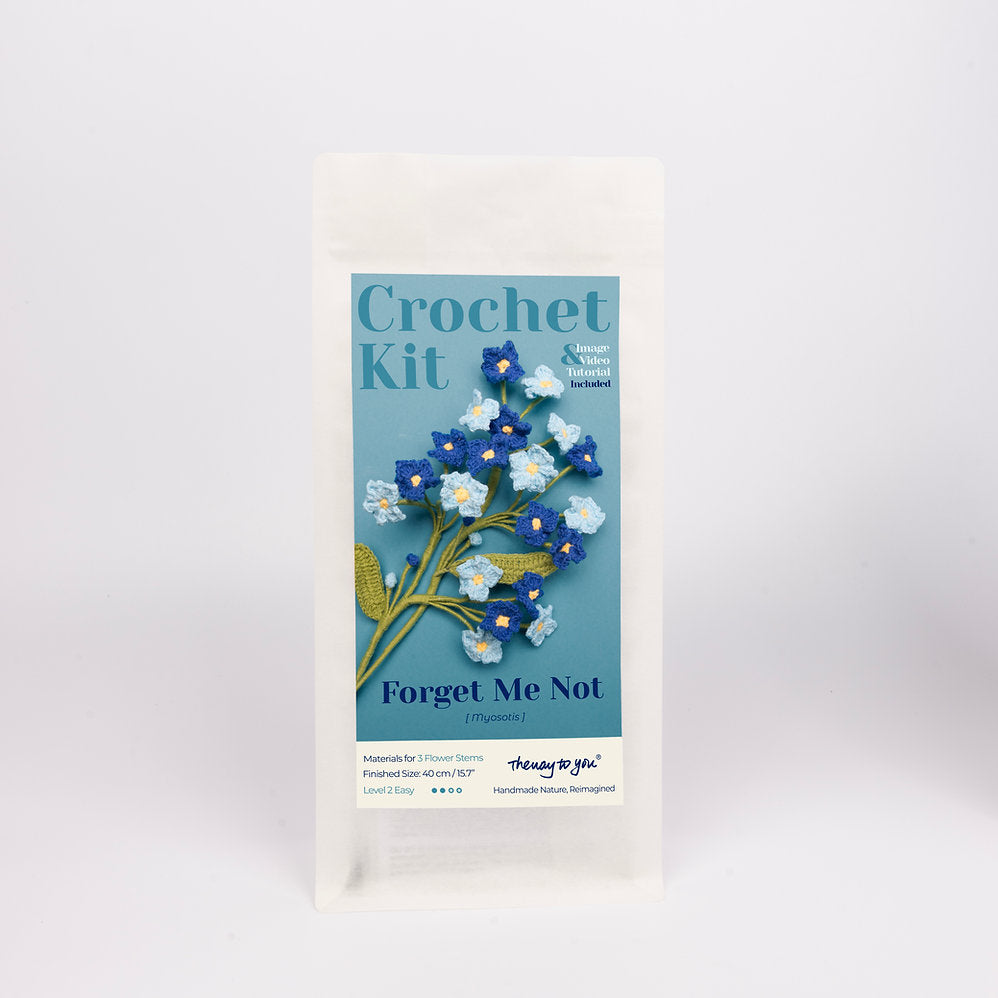 Crochet kit packaging with floral design on a white background