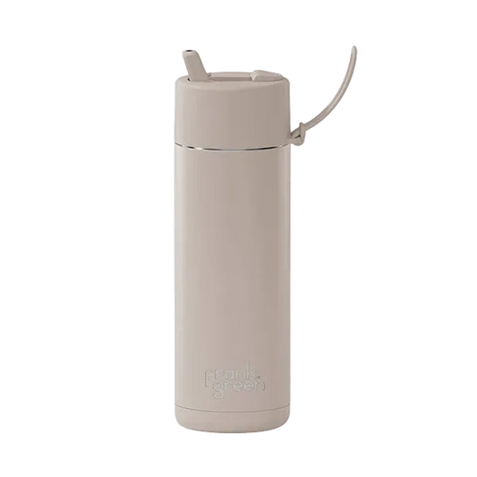 A minimalist, matte beige vacuum-insulated water bottle with a matching beige flip-top lid and carrying loop, featuring the 'frank green' logo near the base, set against a plain white background.