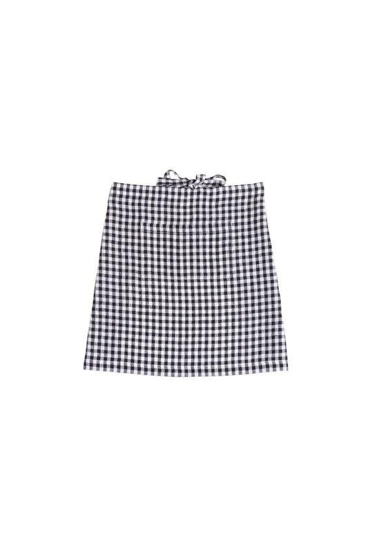A black and white gingham mini skirt apron with a tie-waist detail, shown flat against a solid white background.
