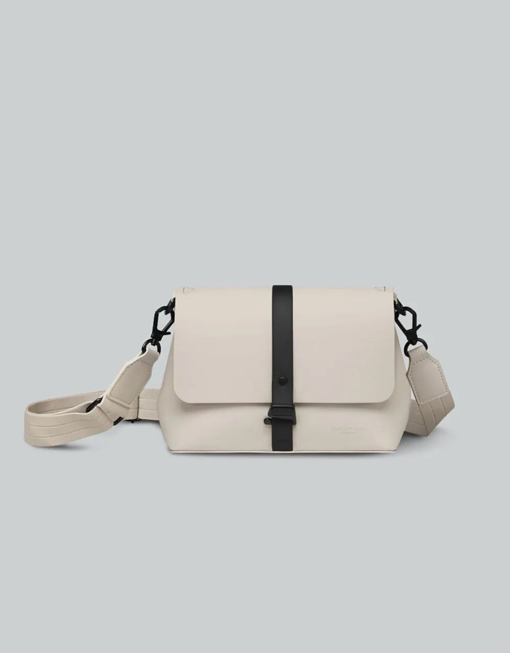 Gaston Luga Splash Crossbody Bag in Cloud Cream on a grey background