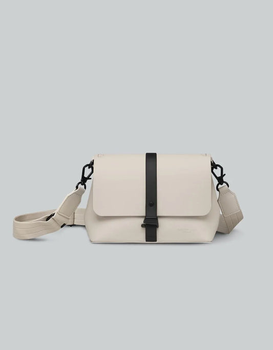 Gaston Luga Splash Crossbody Bag in Cloud Cream on a grey background