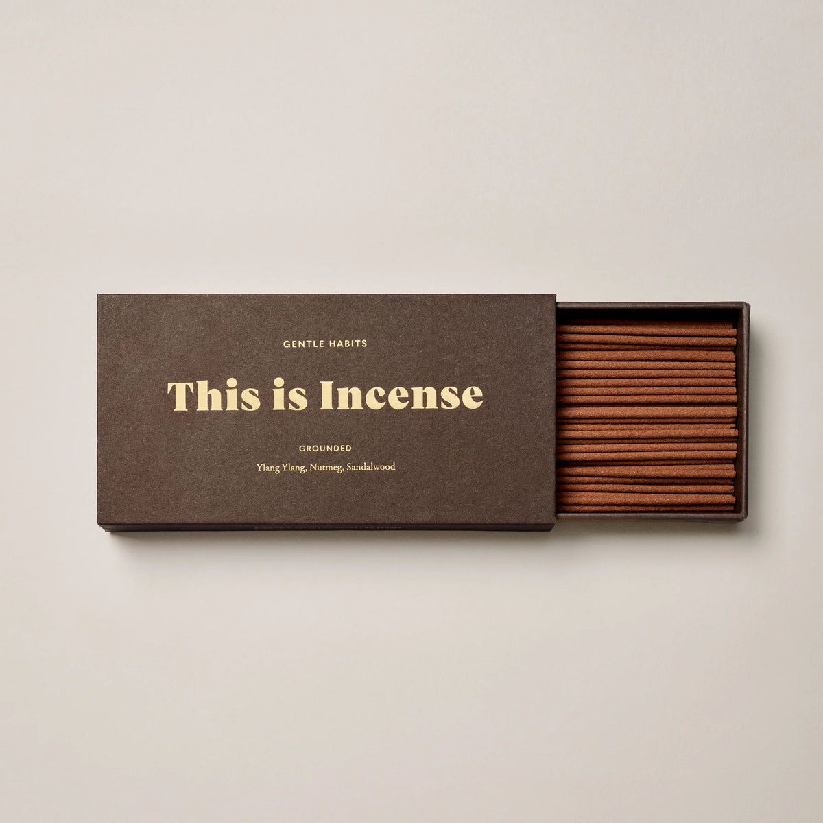 Brown Box showing half open box filled with incense on a wite background 