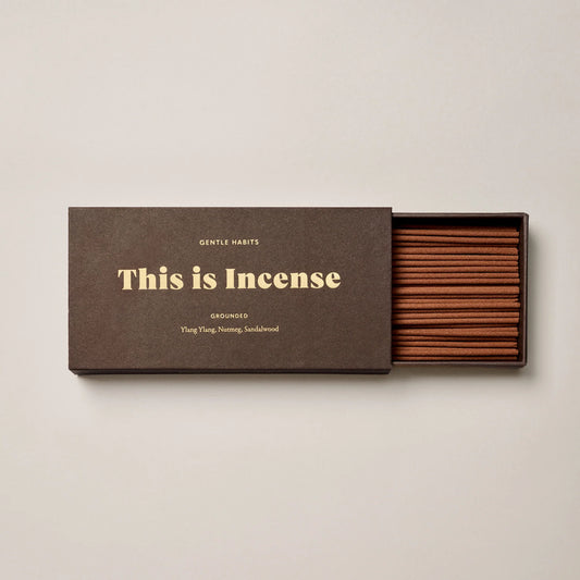 Brown Box showing half open box filled with incense on a wite background 