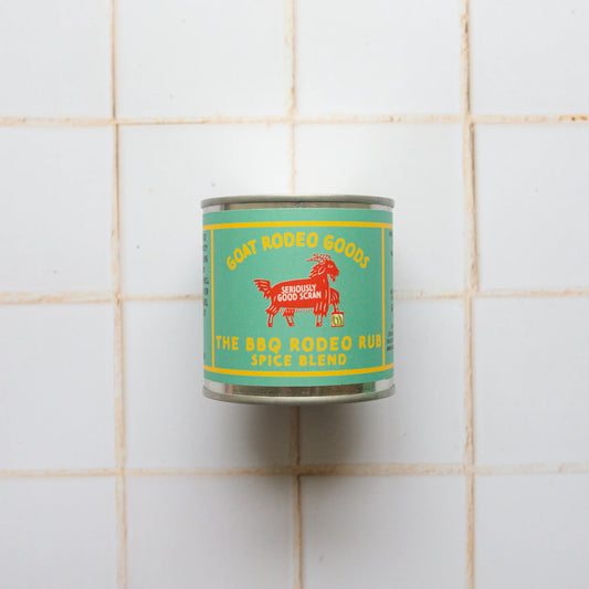 Can of 'The BBQ Rodeo Rust Spice Blend' on a tiled wall