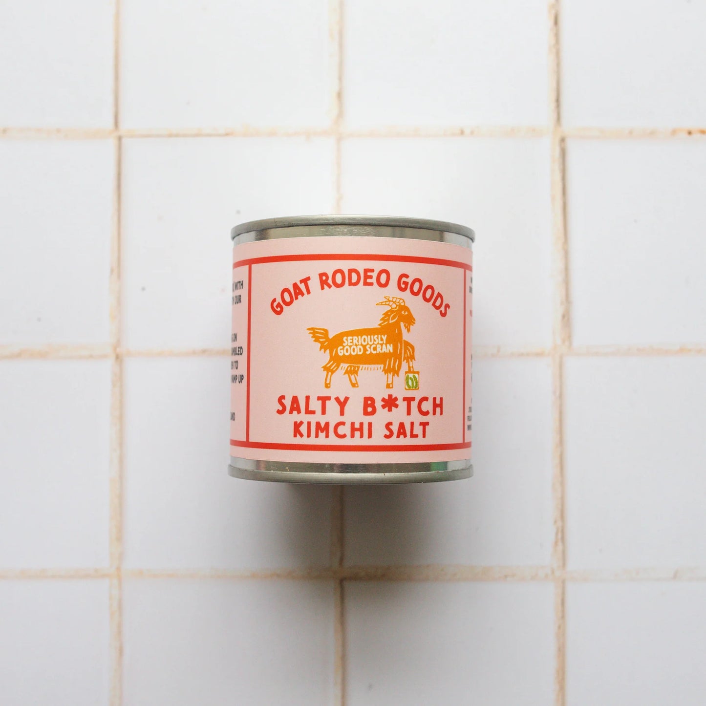 Can of Goat Rodeo Goods Salty B*tch Kimchi Salt on a tiled wall