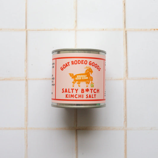 Can of Goat Rodeo Goods Salty B*tch Kimchi Salt on a tiled wall