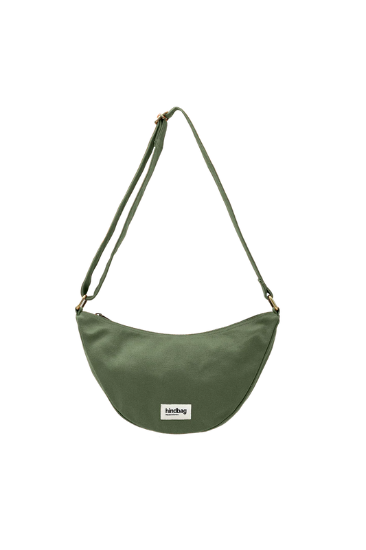 Green shoulder bag with a visible brand label on a white background