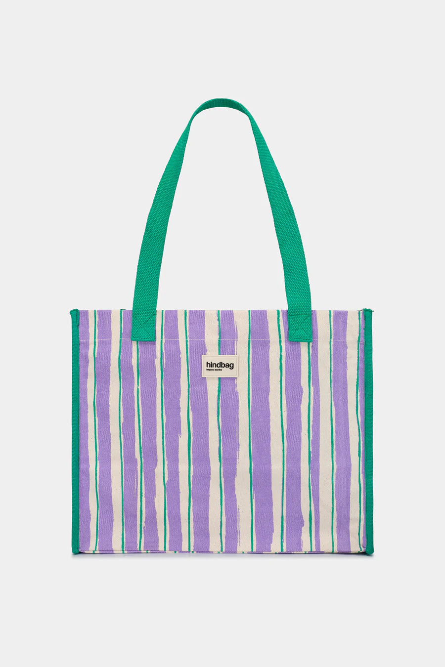 Striped tote bag with green handle on a light gray background