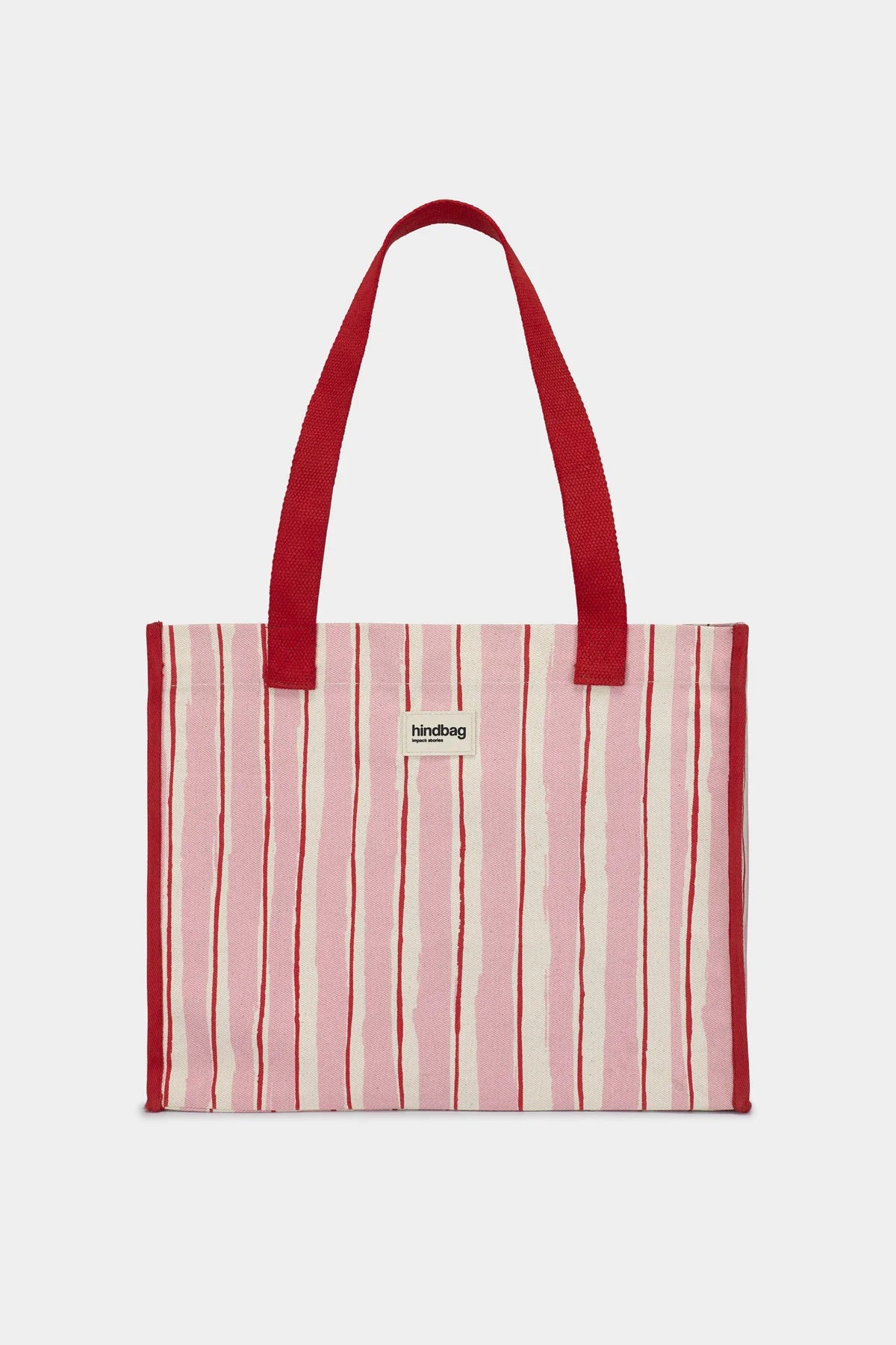 Striped tote bag with red handles on a white background