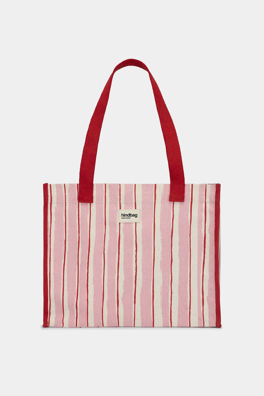 Striped tote bag with red handles on a white background