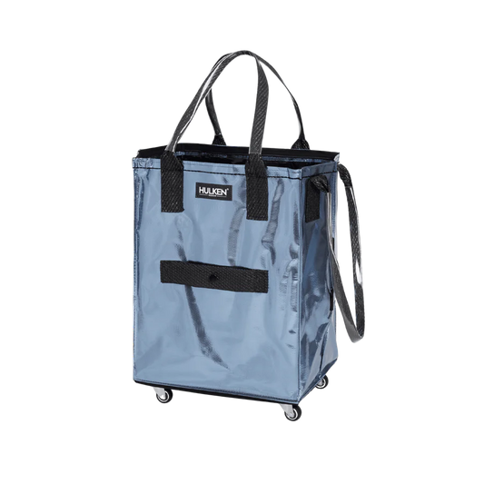 A Harken blue shopping tote bag with black handles, a black front strap, and black wheels, shown on a plain white background.