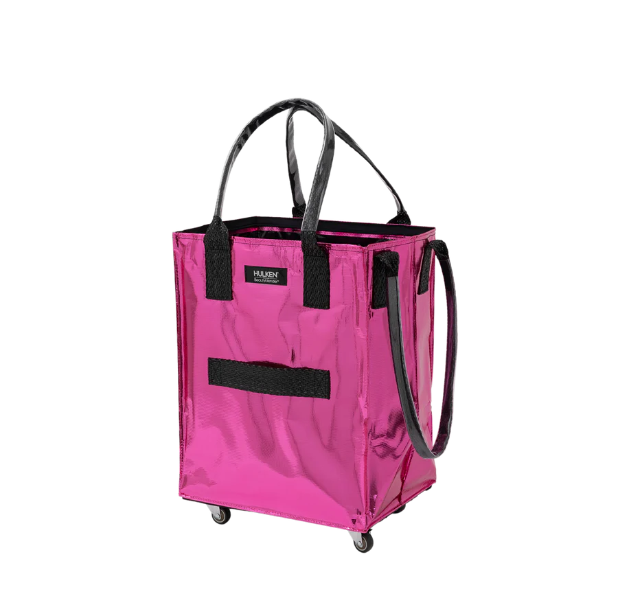 A metallic hot pink utility tote bag with black handles, a black front strap, and a small black brand label that reads 'Hulken'. It is shown on a plain white background with no people or environment.