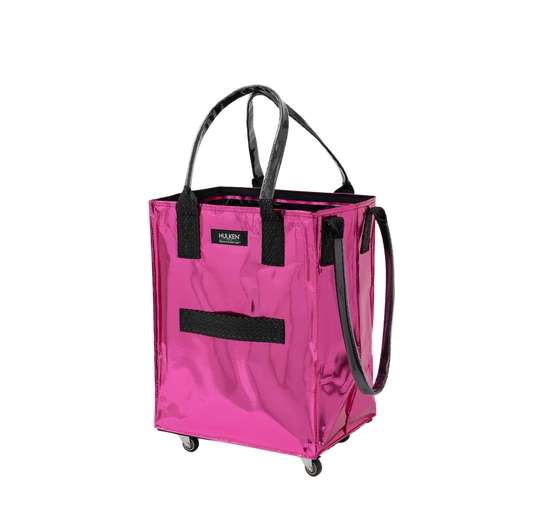 A metallic hot pink utility tote bag with black handles, a black front strap, and a small black brand label that reads 'Hulken'. It is shown on a plain white background with no people or environment.