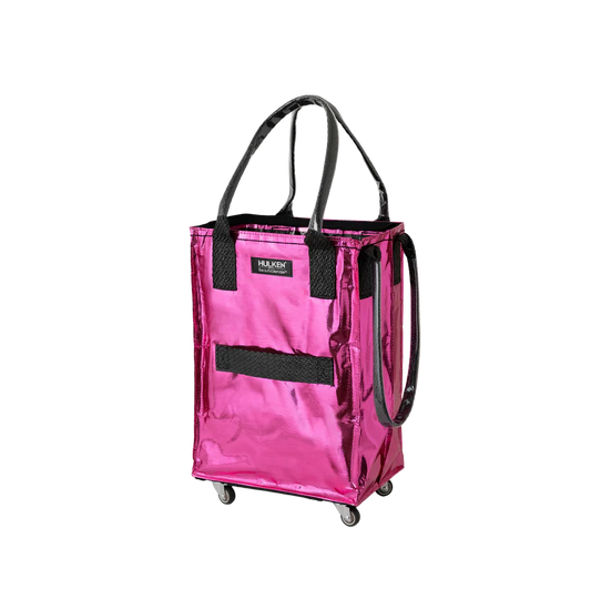 A metallic pink rolling utility tote bag with black handles, a black front mesh pocket, and small caster wheels, shown on a plain white background.