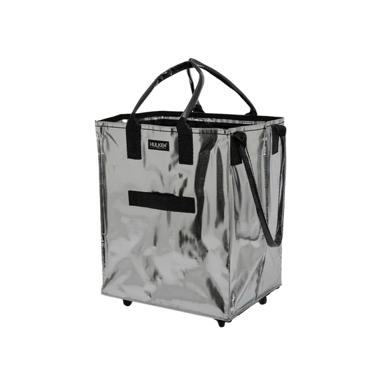 Silver shopping cart with black handles on a white background