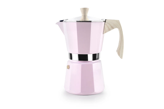 Pink espresso maker with a white handle on a white background