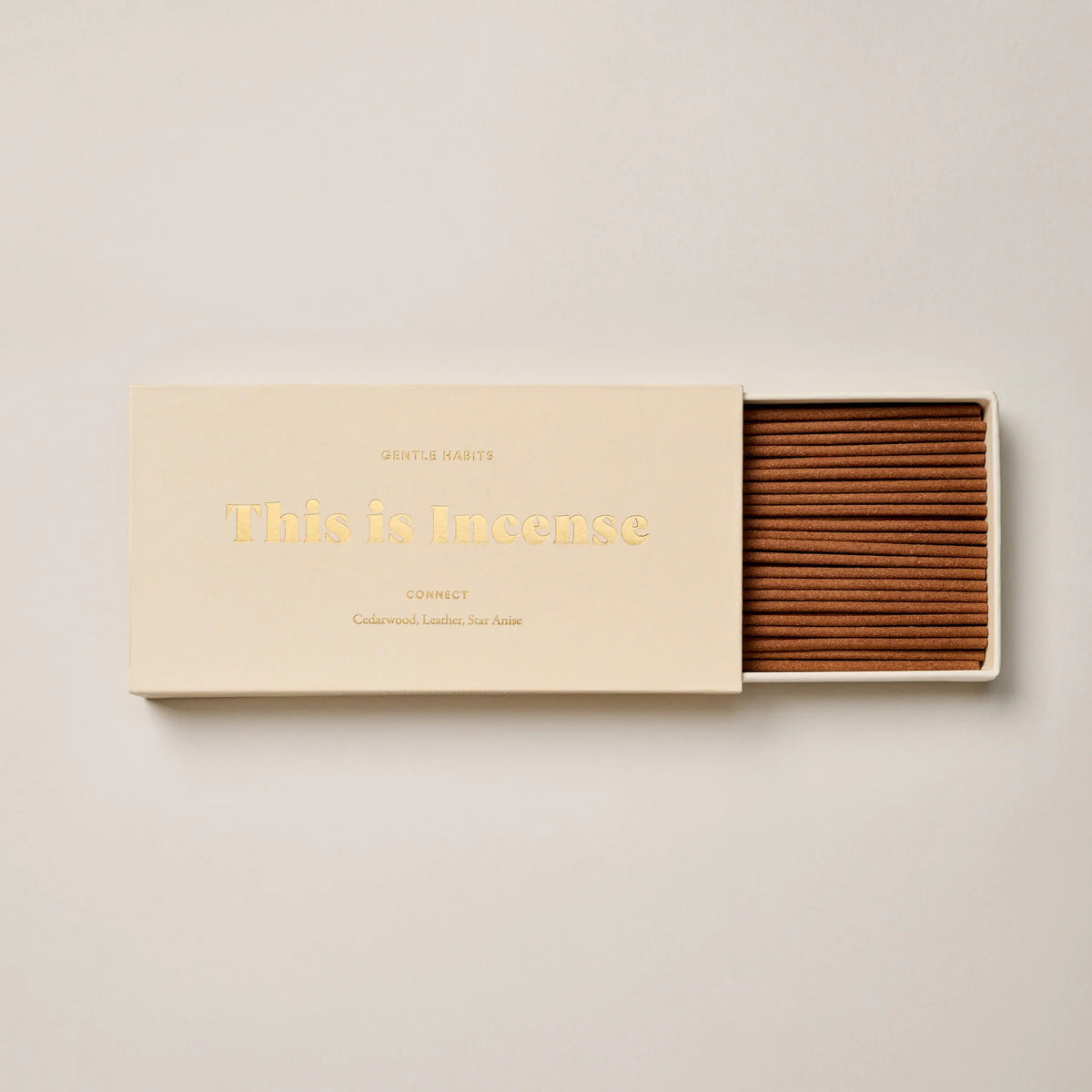 Incense sticks in a box with 'This is incense' text on a beige background