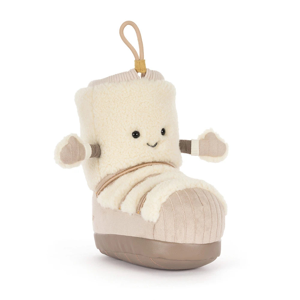 A plush boot-shaped toy shaped like a snow boot on a white background 