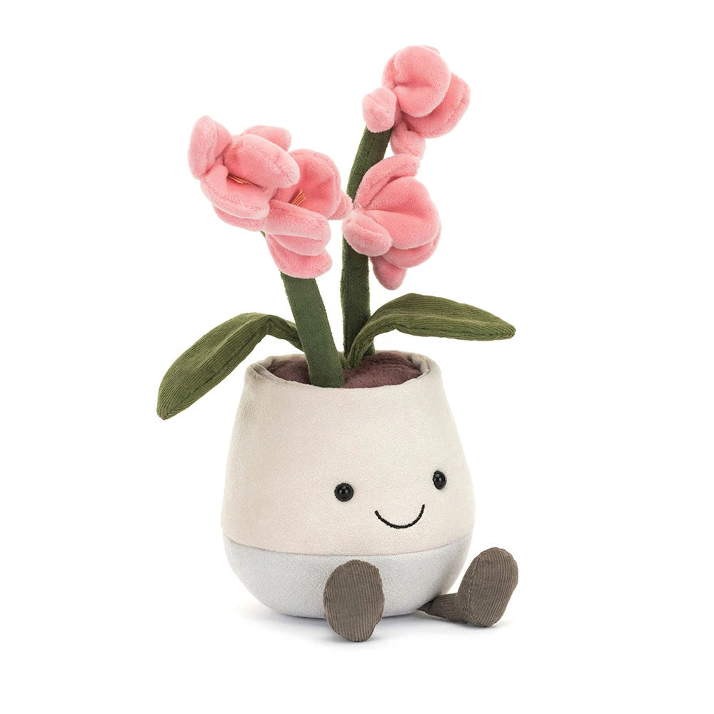 Plush toy flower in a pot with pink flowers on a white background