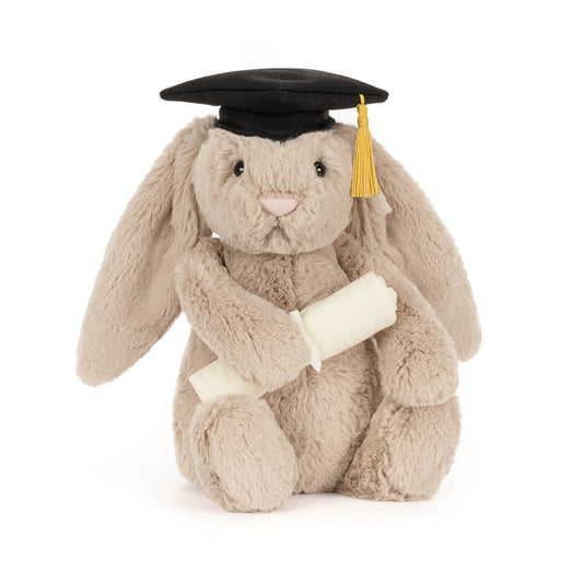 Plush bunny toy wearing a graduation cap on a white background