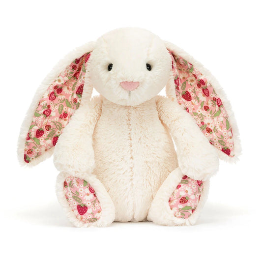 Plush bunny toy with floral ears and paws on a white background