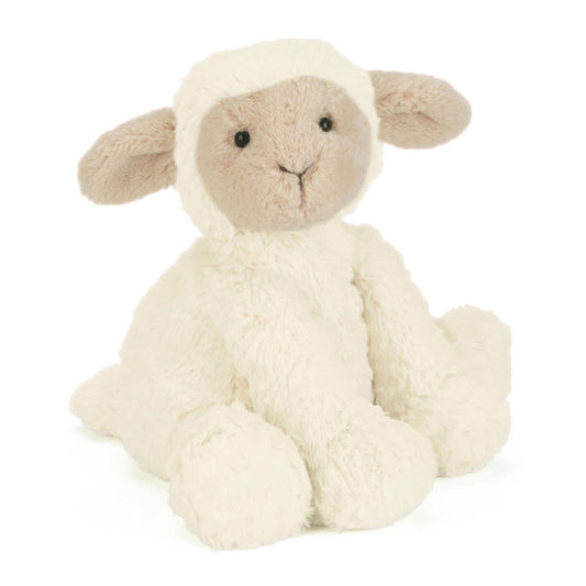 Plush toy sheep on a white background