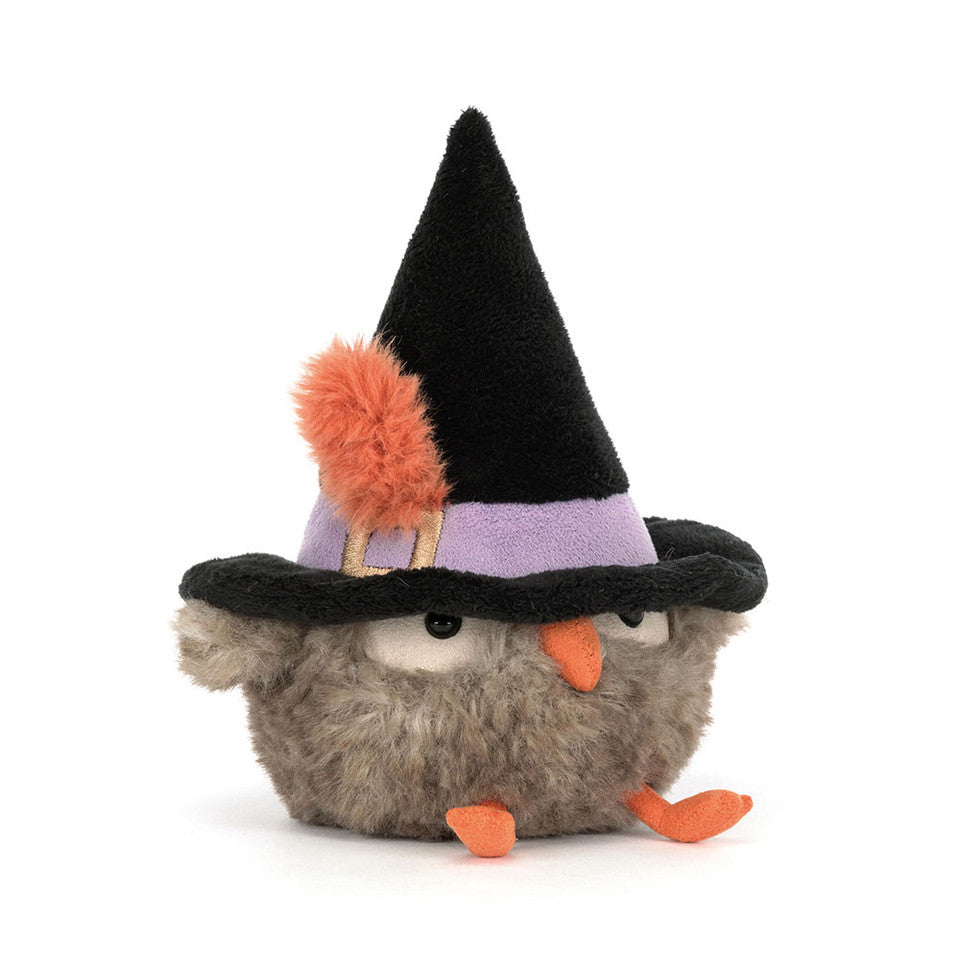 Plush toy resembling a creature with a witch hat on a white background