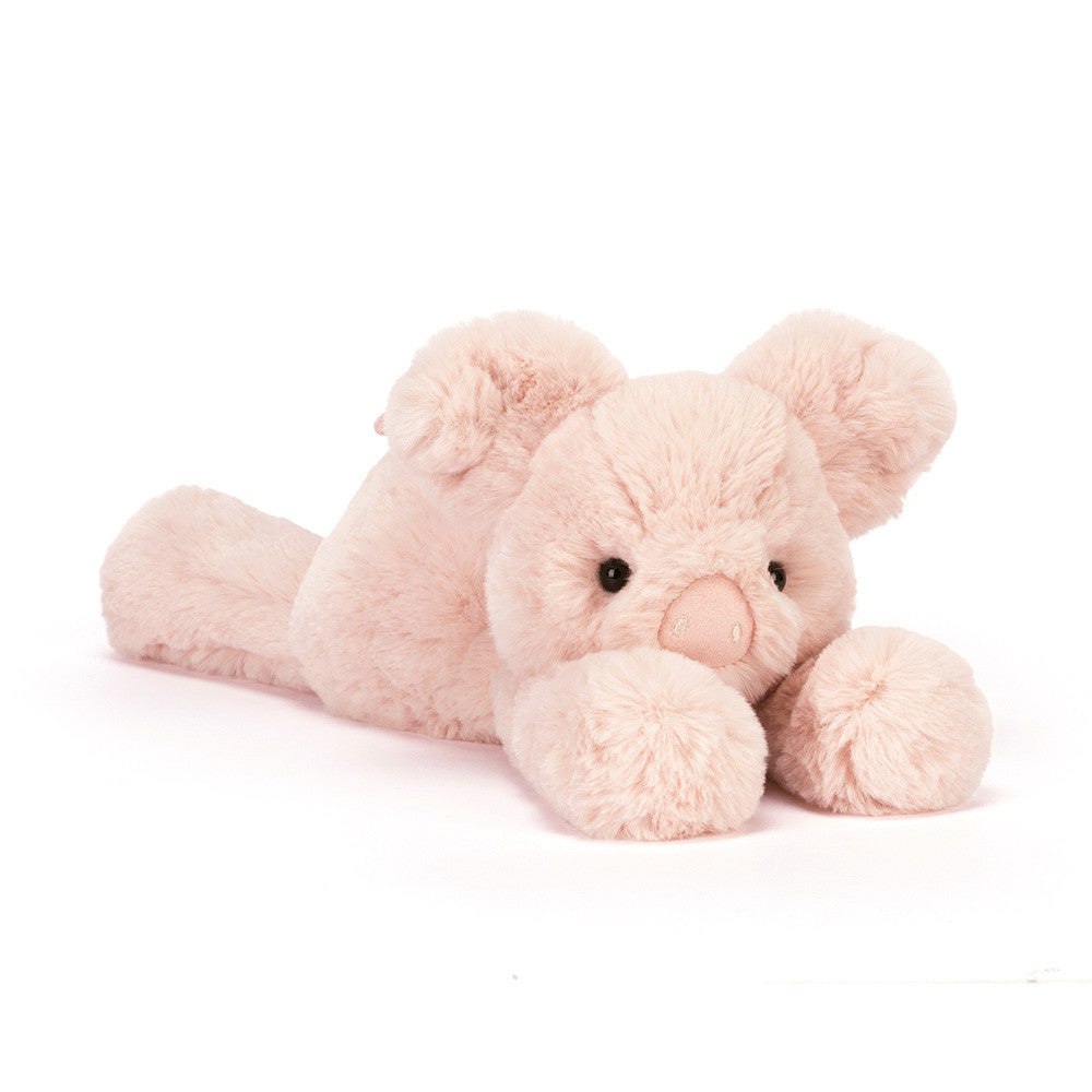 Pink plush elephant toy on a white background