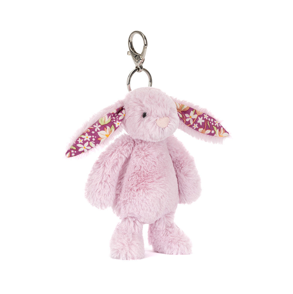 Pink bunny keychain with floral ears on a white background