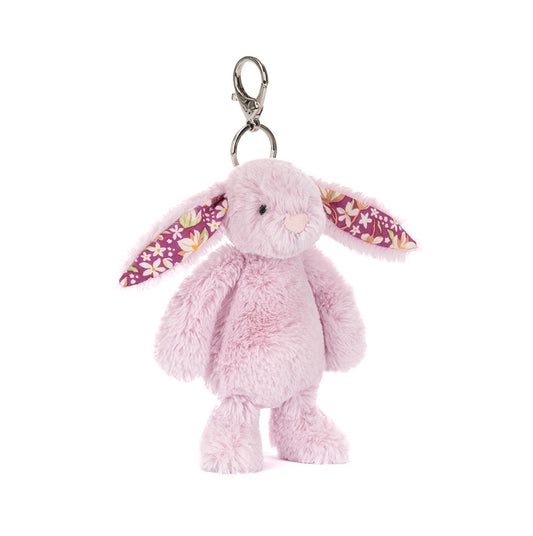 Pink bunny keychain with floral ears on a white background