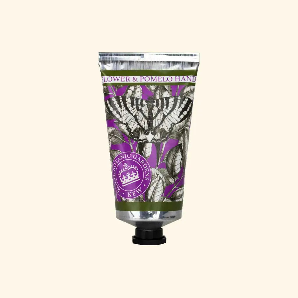 The English Soap Company Kew Gardens Elderflower and Pomelo Hand Cream in purple and green packaging on a cream background 